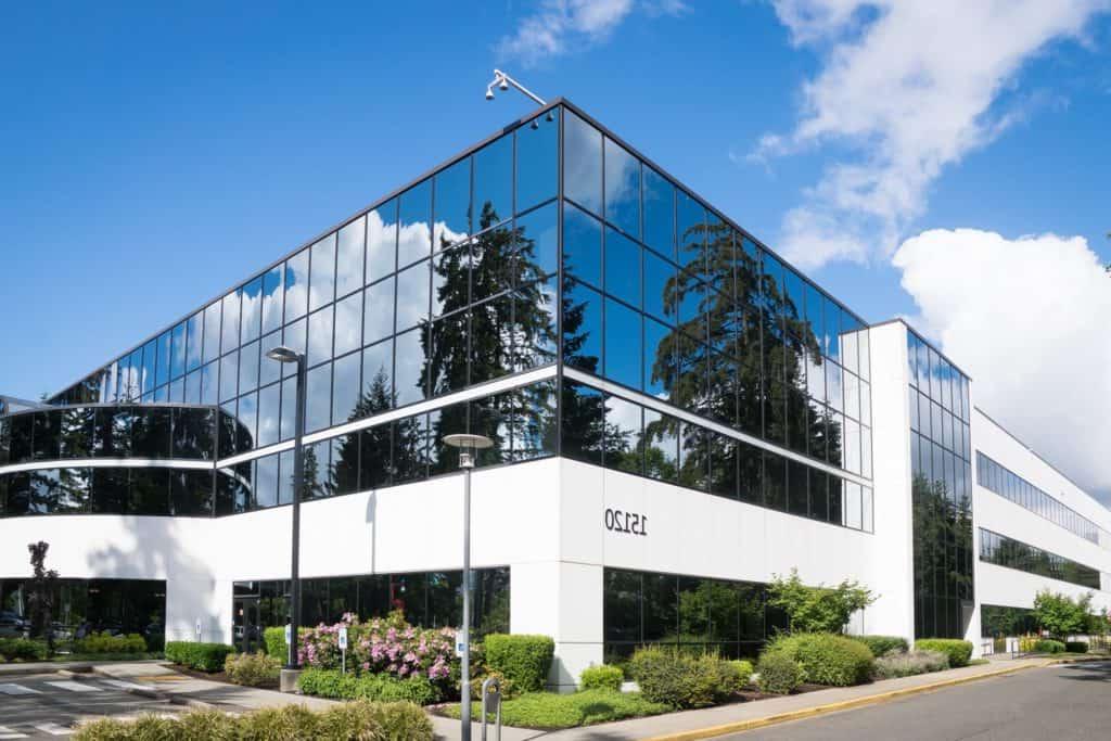 Photos of a mirrored office building on the corner